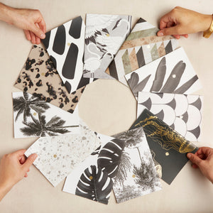 Hello Day 2024 Mini Notebooks in a circle with four hands holding four notebooks