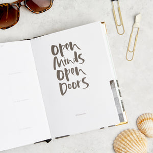 Inspirational quote in Hello Day 2024 weekly daily planner diary journal with paperclips